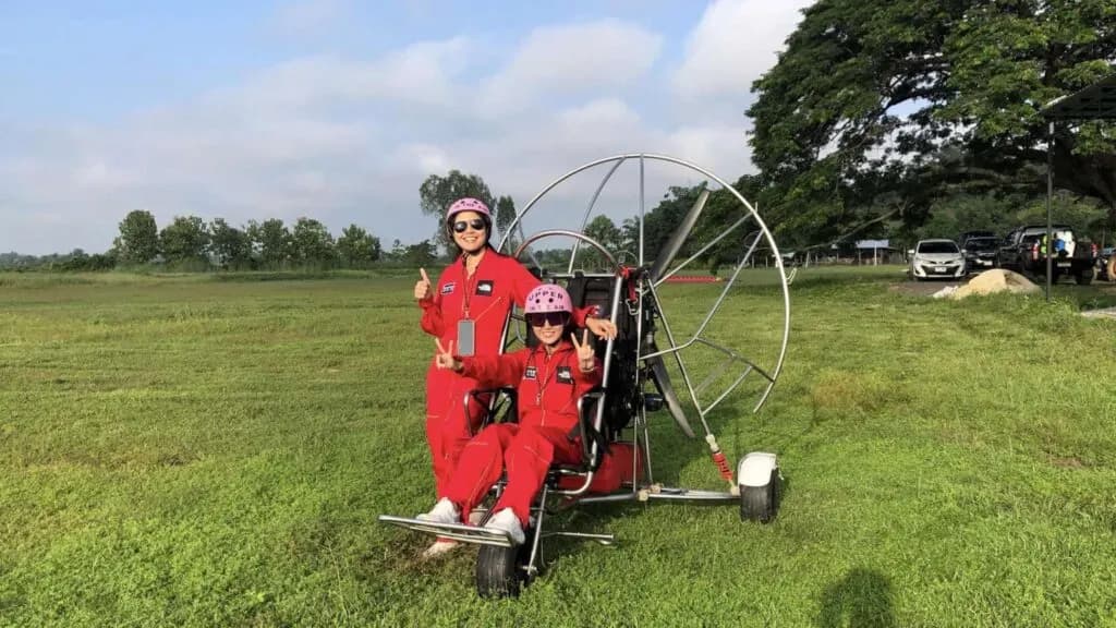 Happy participants ready for a paramotor flight on a Chiang Mai tour