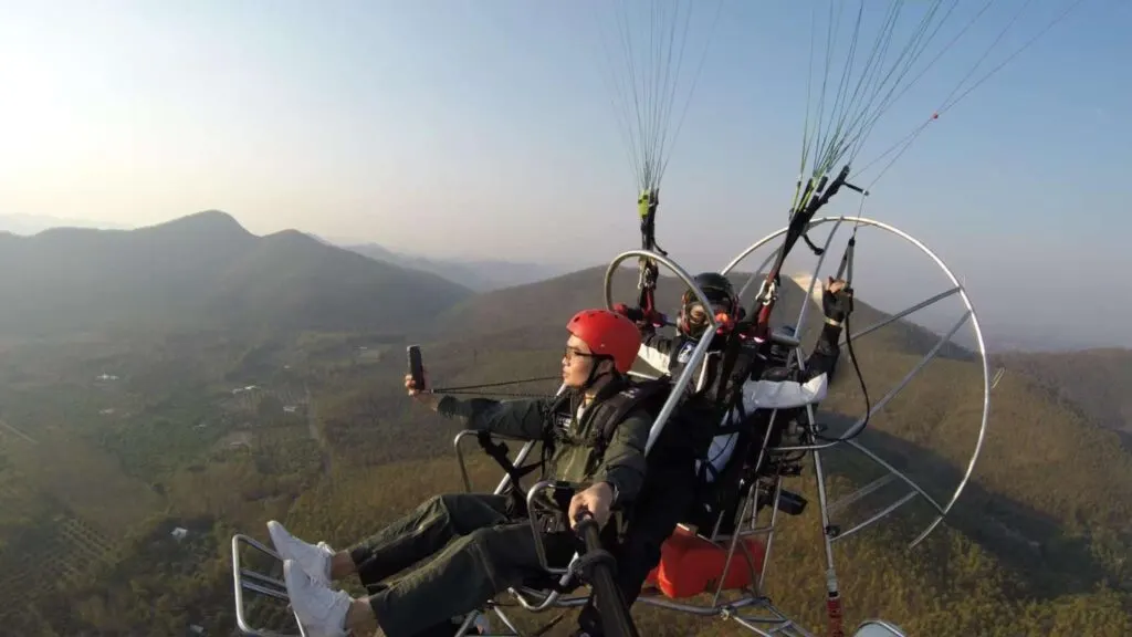 Tourist flying high on a paramotor adventure in Chiang Mai