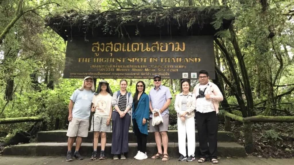 Tourist Group at the Highest Spot in Thailand Sign on a Doi Inthanon Tour