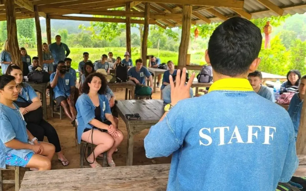 Staff at Living Green Elephant Sanctuary sharing stories and explaining to tourists during a Chiang Mai excursion