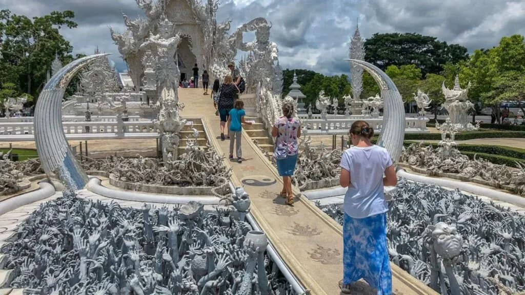 Iconic White Temple (Wat Rong Khun) in Chiang Rai, a top highlight of Chiang Mai to Chiang Rai tours, showcasing stunning architecture and intricate details.