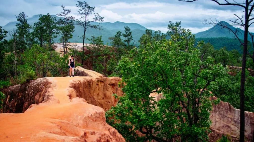 Scenic landscape of striking red rock formations and rugged terrain in Pai.