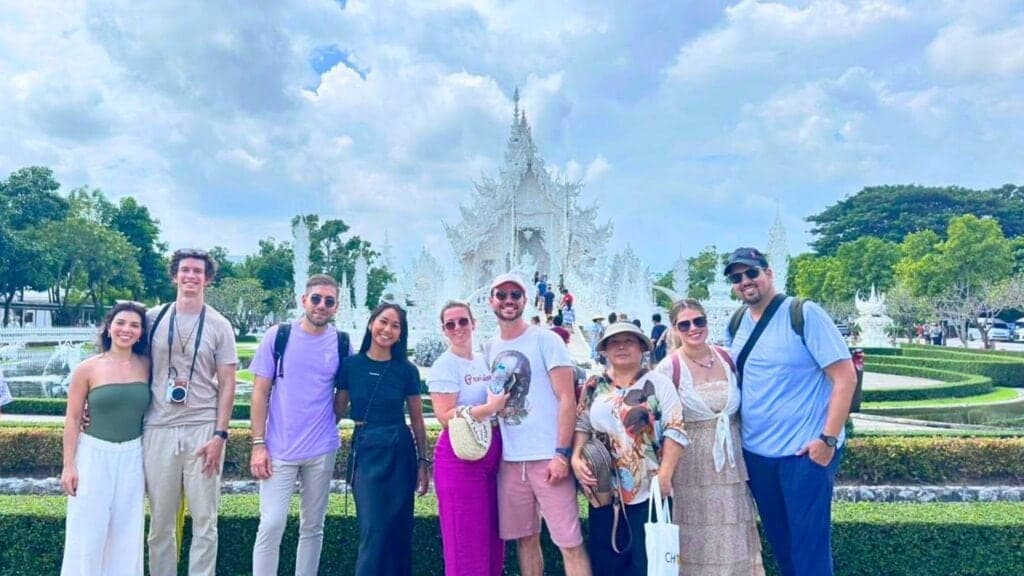 A tour group visiting the White Temple in Chiang Rai