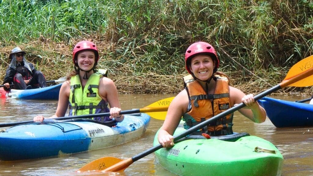 Kayaking on a river, a highlight of an adventure tour near Chiang Mai