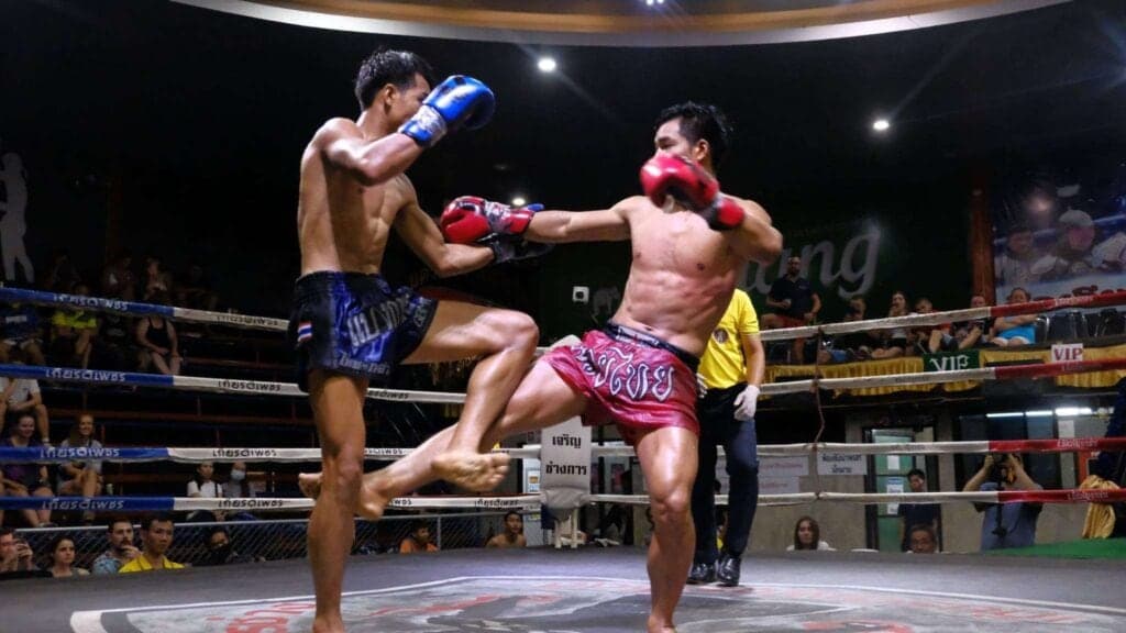 Muay Thai fighters in action at a Chiang Mai stadium