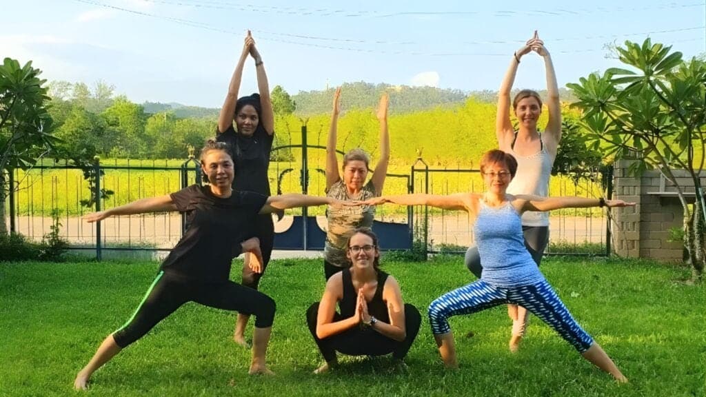 Stretching during a Chiang Mai wellness and yoga session