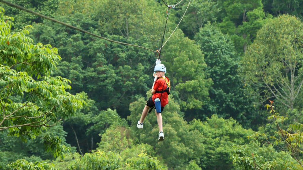 Child enjoying a safe and fun zipline ride in Chiangmai