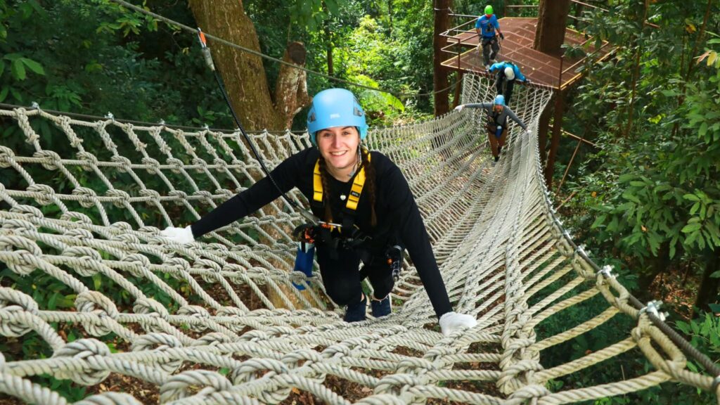 Climbing the rope bridge on a Chiangmai jungle adventure