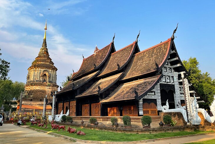 This image is used to showcase the historical and architectural significance of Wat Lok Moli, a renowned temple in Chiang Mai. It serves to attract tourists interested in culture and history, highlighting a popular destination within the region. The image could be featured in travel guides, cultural heritage blogs, or promotional materials for tours in Chiang Mai, aiming to enhance the visual appeal and provide information about key attractions in the area.