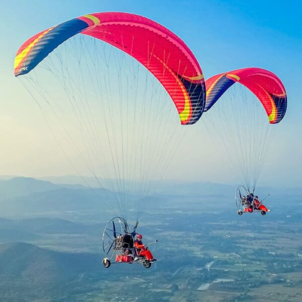 Experience the thrill of paramotoring in Chiangmai with our exciting Chiangmai tour excursions, soaring high above the scenic landscapes.