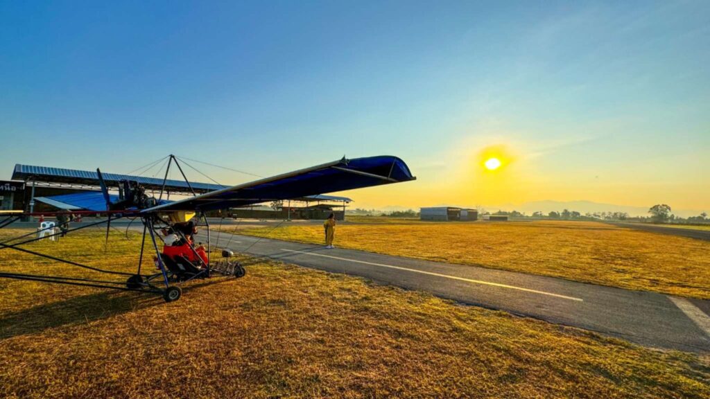 Ultralight aircraft ready for takeoff at sunrise during a Chiang Mai tour, perfect for adventure seekers exploring Chiang Mai excursions.