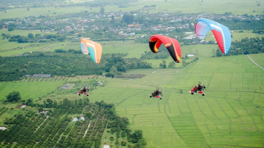 Paramotor adventure over the countryside, showcasing the beauty of Chiang Mai tours
