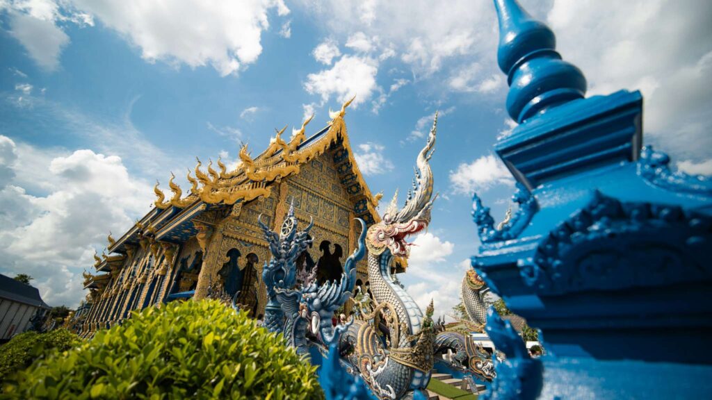 Exterior view of Wat Rong Suea Ten, the famous Blue Temple in Chiang Rai