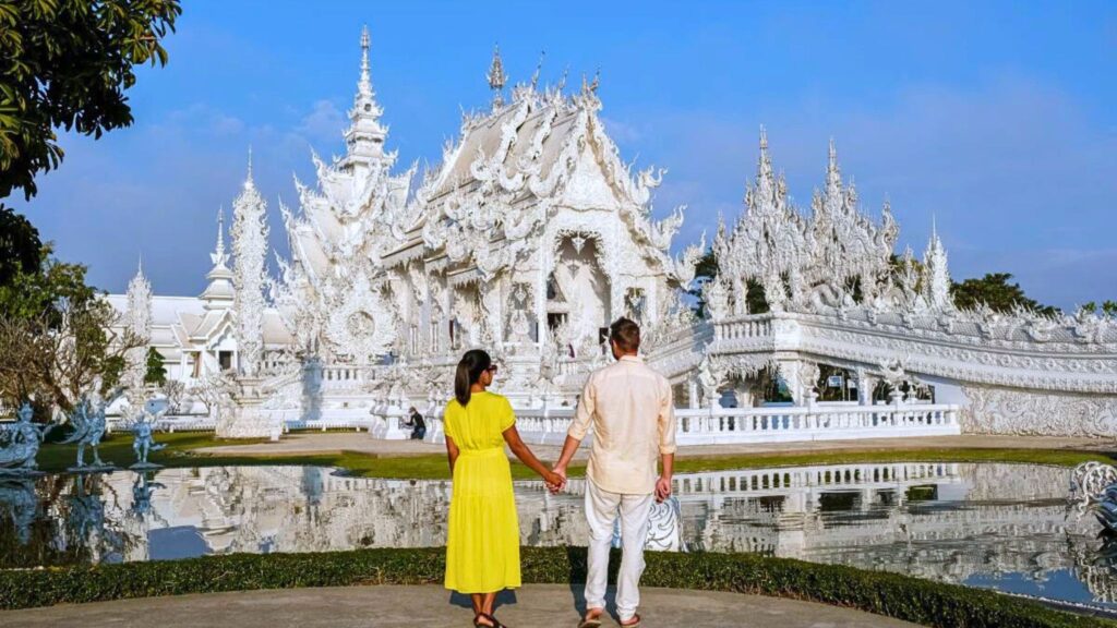 architecture of the White Temple (Wat Rong Khun) in Chiang Rai, Thailand, under a clear blue sky