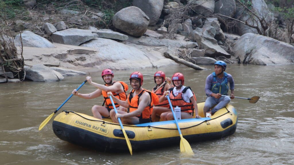 Group of travellers enjoying an exhilarating white water rafting adventure on a Chiang Mai tour