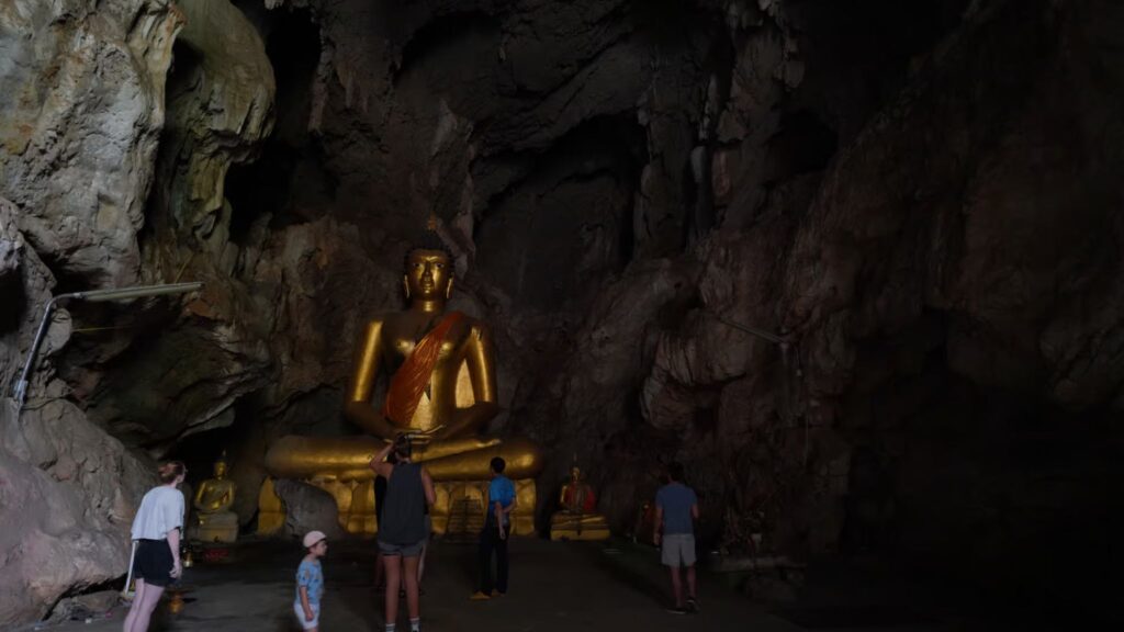 Traveler exploring the legendary Bua Tong Cave in Chiang Mai Tour