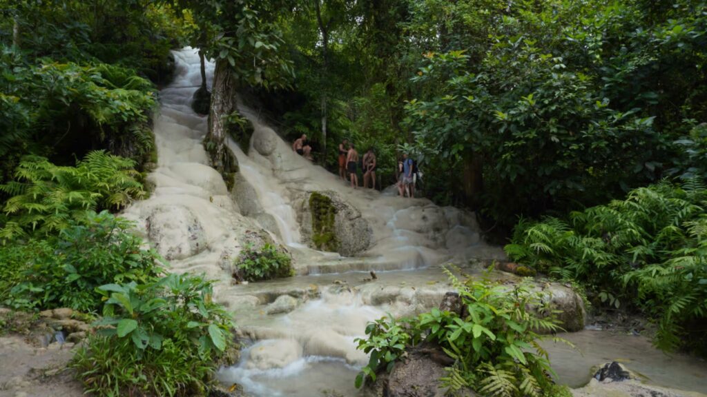 Climbing the limestone tiers at Sticky Waterfall Chiang Mai Tour