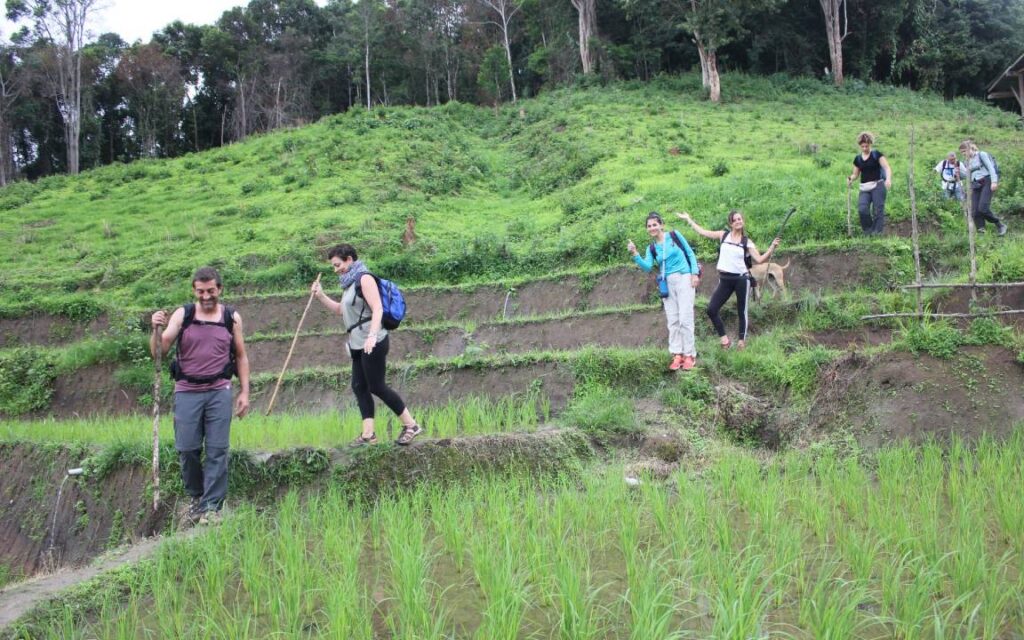 Happy traveler enjoying a trekking adventure in Chiang Mai's tour.
