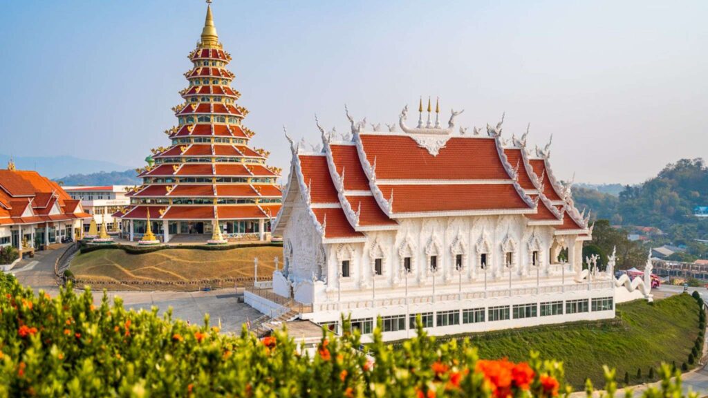 Majestic Red Temple (Wat Huay Pla Kang) in Chiang Rai, home to a towering Guan Yin statue, part of the Chiang Mai and Chiang Rai excursion tour.