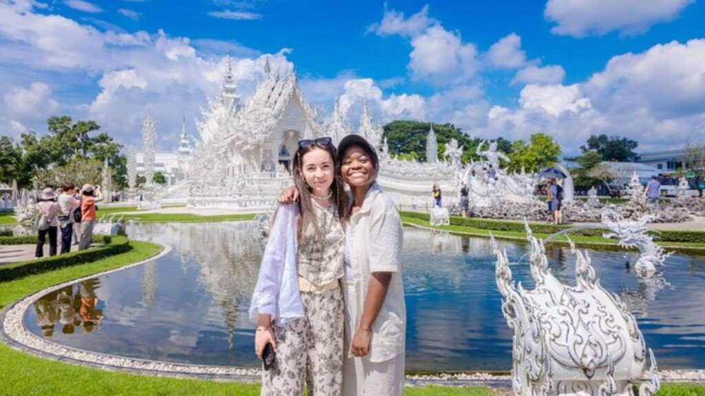 Stunning White Temple (Wat Rong Khun) in Chiang Rai, a must-see for Chiang Mai tours, featuring intricate details and surreal design on a Chiang Rai excursion.