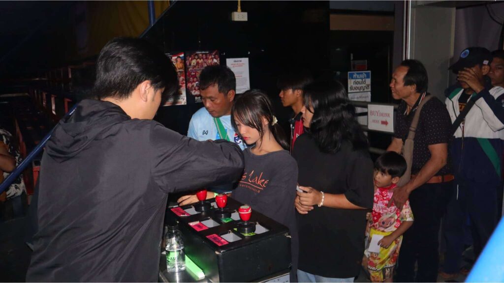 Guests waiting to enter Chiang Mai Boxing Stadium for an unforgettable Muay Thai night on their Chiang Mai tour.