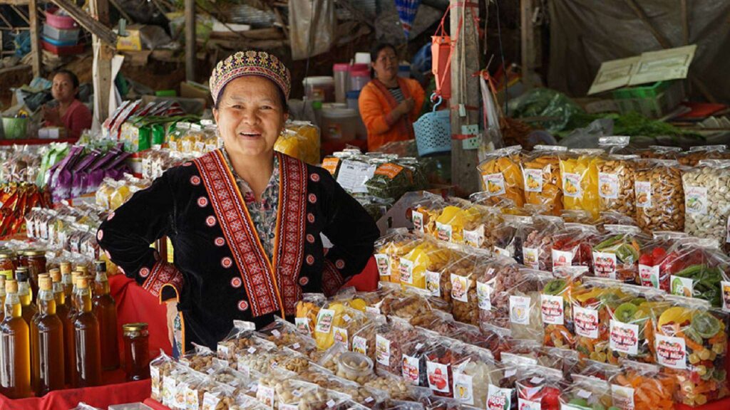 Karen villager at the Karen market, showcasing local culture during a Chiang Mai excursion