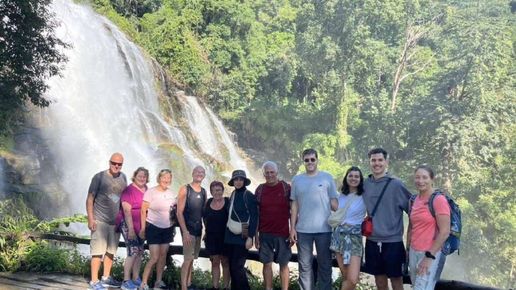 Tourists taking in the views of waterfall during a Chiang Mai excursion