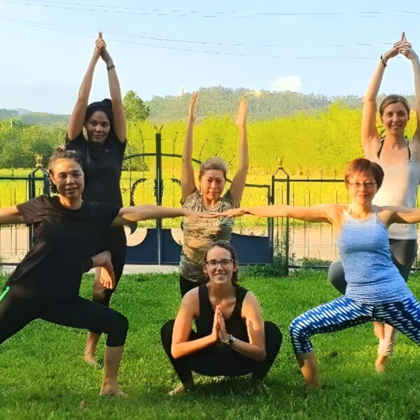 Participants stretching during a Chiang Mai wellness and yoga tour at a retreat center.