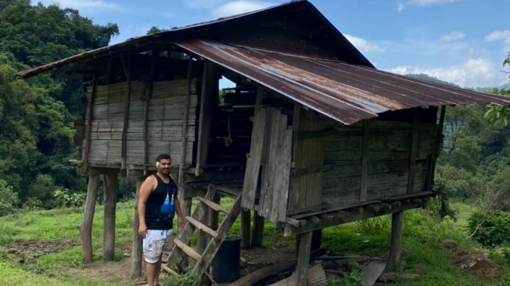 Traditional wooden Karen house in Doi Inthanon village, part of cultural trekking experience on Chiangmai tours