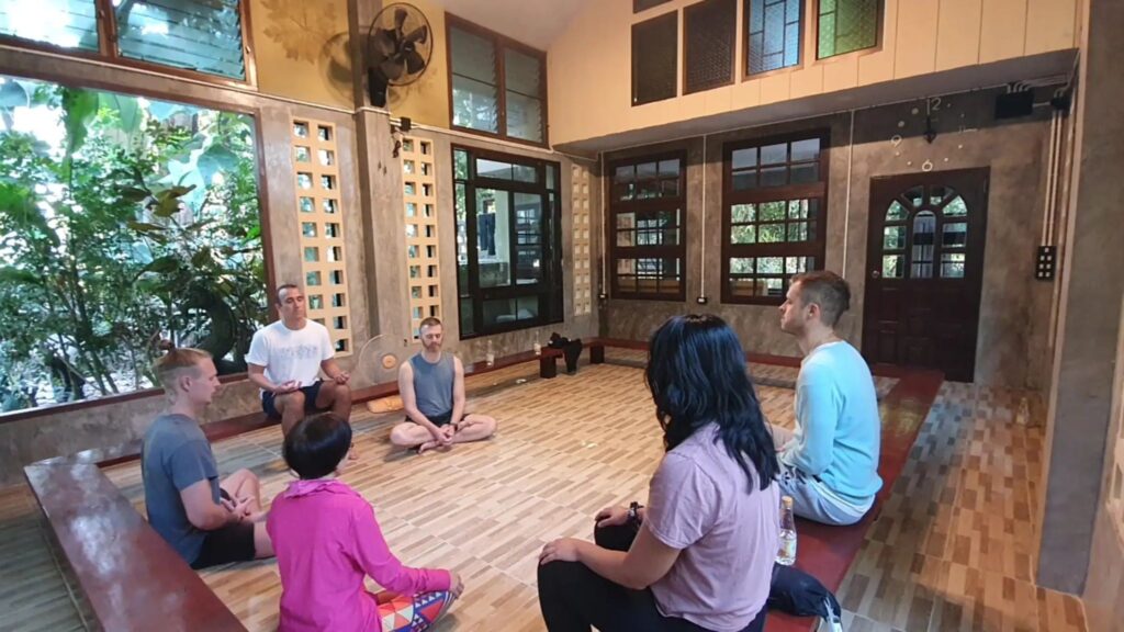 Participants in a group mindfulness session during a Chiang Mai yoga and meditation retreat.